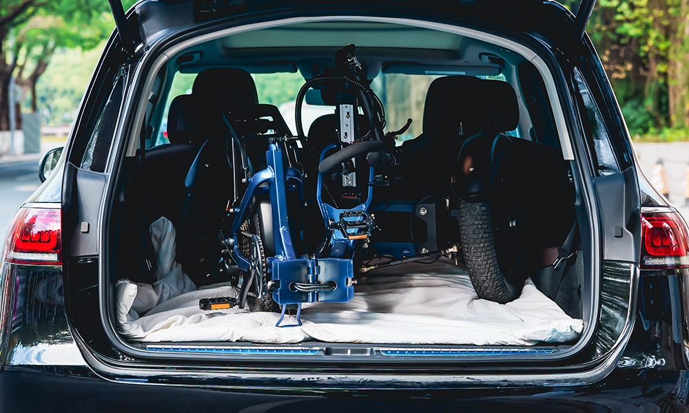 A spytanx reverse trike is folded into a car